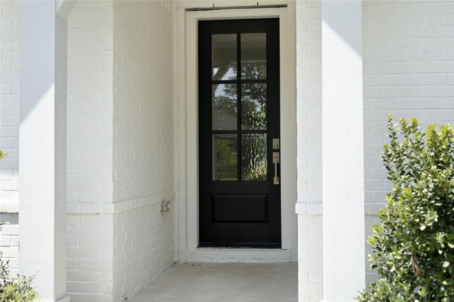 There is a warm invitation to this modern farmhouse entrance surrounded by well maintained landscaping. There is a warm invitation to this modern farmhouse entrance surrounded by well maintained landscaping.
