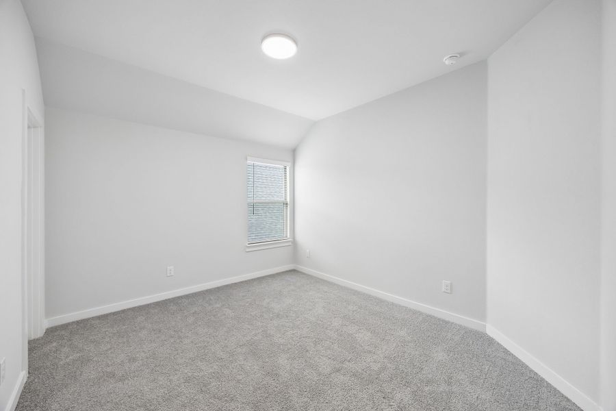 Bedroom in the Winters home plan by Trophy Signature Homes – REPRESENTATIVE PHOTO