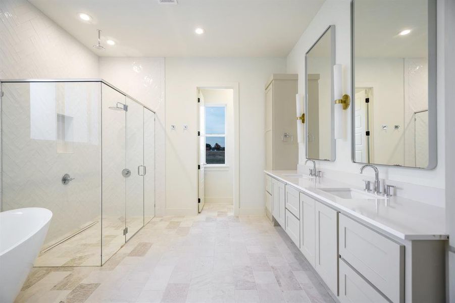 Bathroom featuring plus walk in shower and vanity