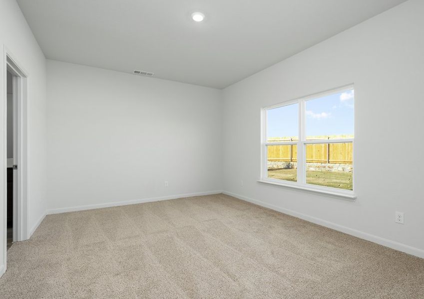 The master bedroom has large windows that let in great, natural light.