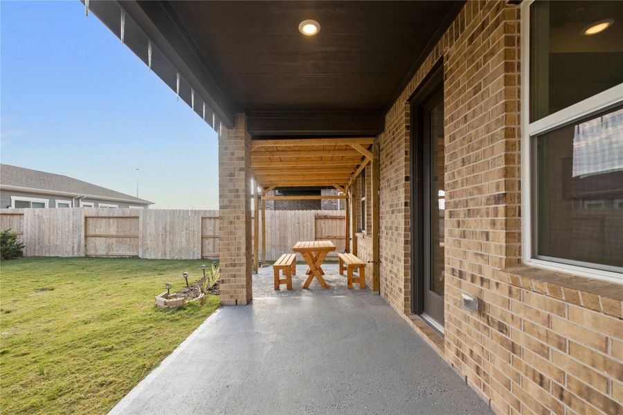 Exterior details and patio area of a home in Avalon at Cypress 40s, Cypress (Image 21).