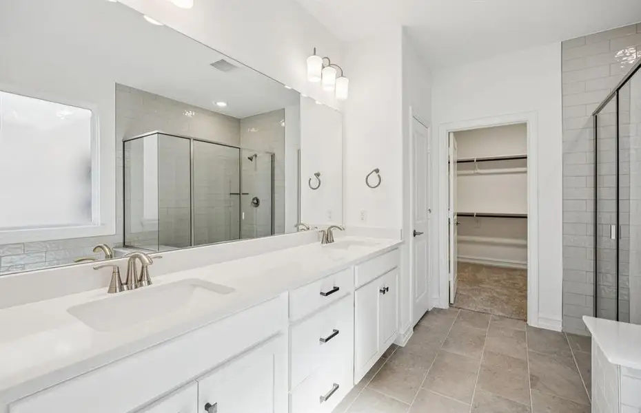 Spacious owner's bath with ample cabinet storage Spacious owner's bath with ample cabinet storage