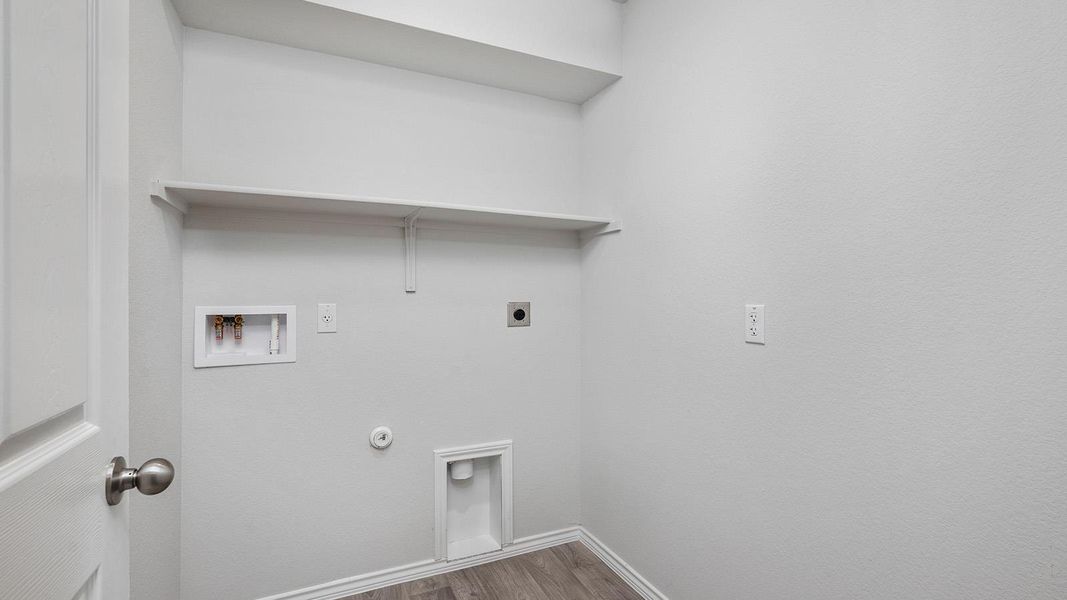 Laundry area with gas dryer hookup, dark wood-type flooring, washer hookup, and hookup for an electric dryer
