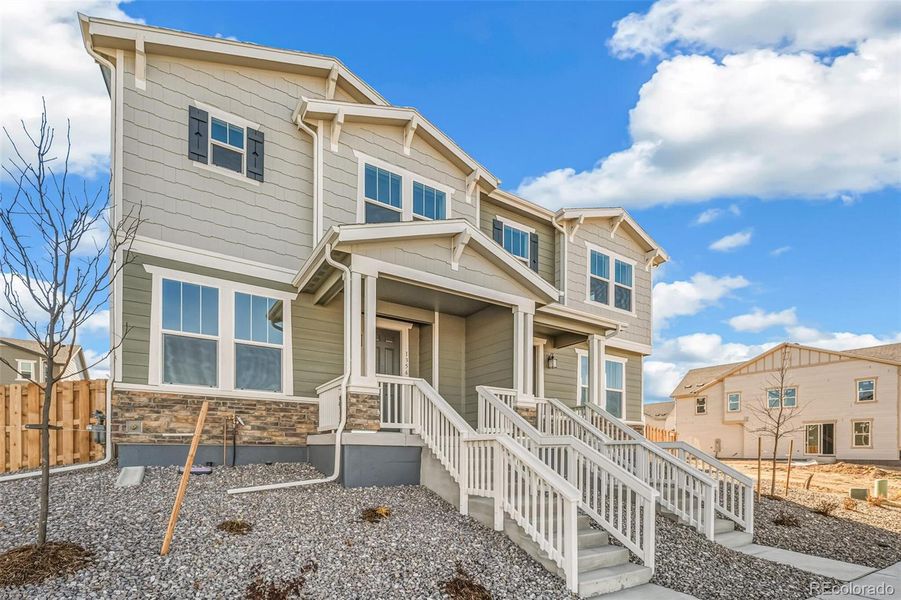 Exterior details and patio area of a home in Turnberry, Commerce City (Image 24).
