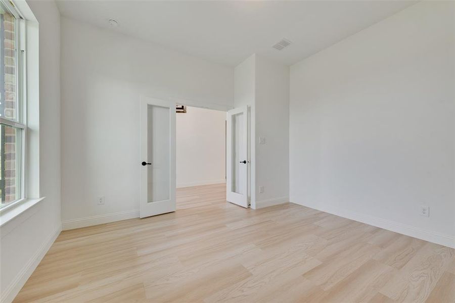 Spare room featuring light hardwood / wood-style floors