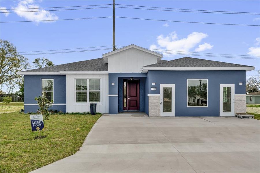 Front exterior of a new home in , Winter Haven, FL, highlighting curb appeal (Image 21).