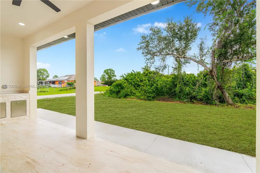 Exterior details and patio area of a home in , Lehigh Acres (Image 27). Exterior details and patio area of a home in , Lehigh Acres (Image 27).