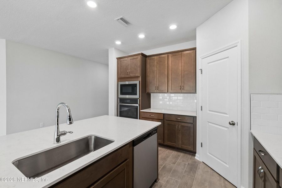 Furnished interior view inside a new home in Tributary 50', Yulee (Image 12).