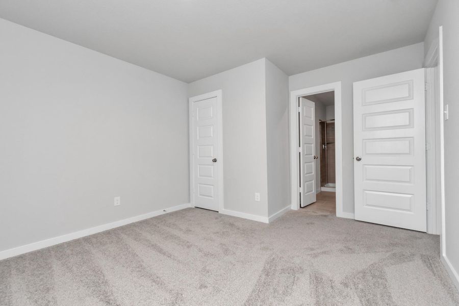 Guest suite with dedicated bathroom. Sample photo of completed home with similar floor plan. Actual colors and selections may vary.