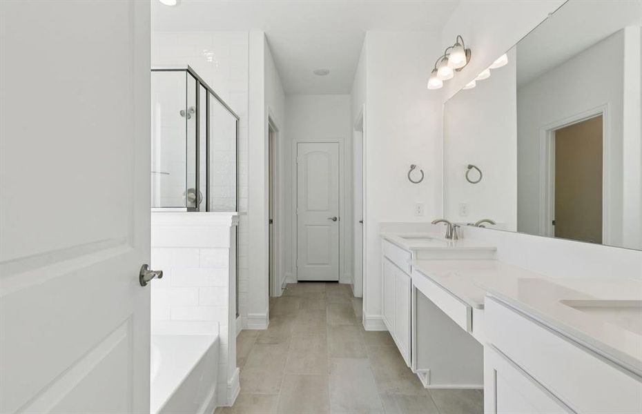 Owner's bath features double vanity and large shower