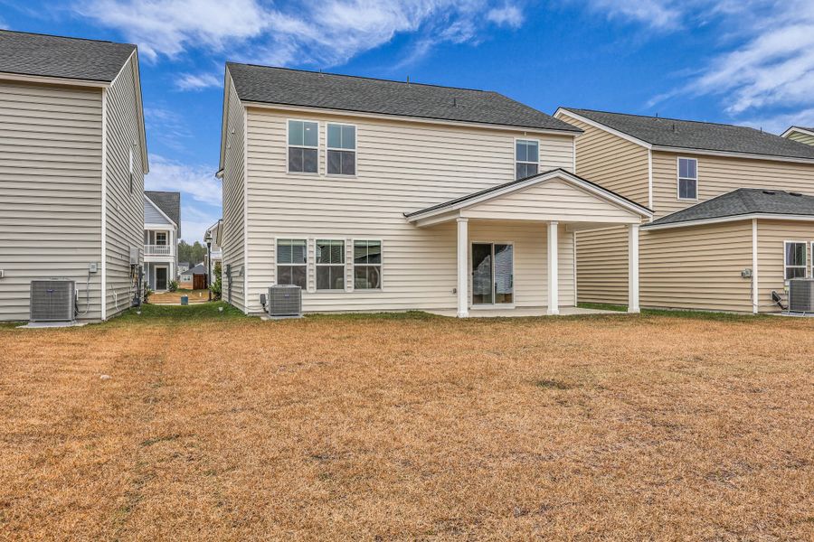Exterior details and patio area of a home in Sweetgrass at Summers Corner: Carolina Collection, Summerville (Image 4).