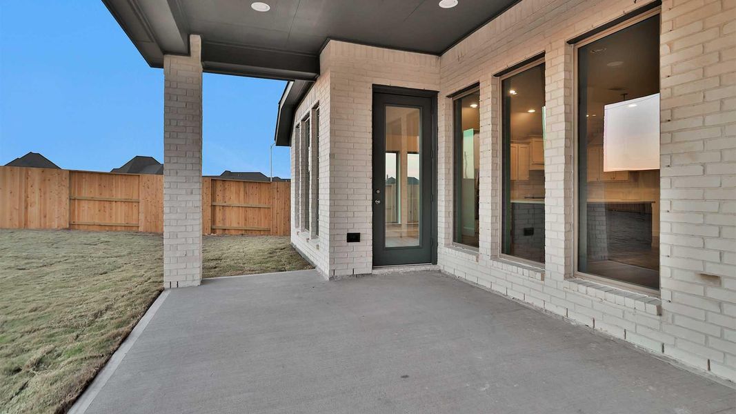 Exterior details and patio area of a home in Meridiana, Manvel (Image 14).
