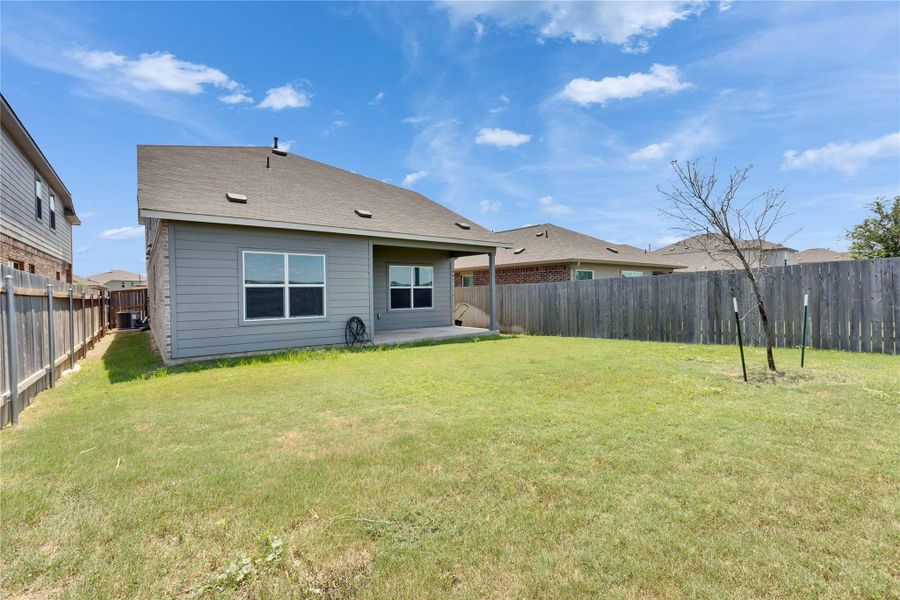 Back of property featuring a fenced backyard. Back of property featuring a fenced backyard.