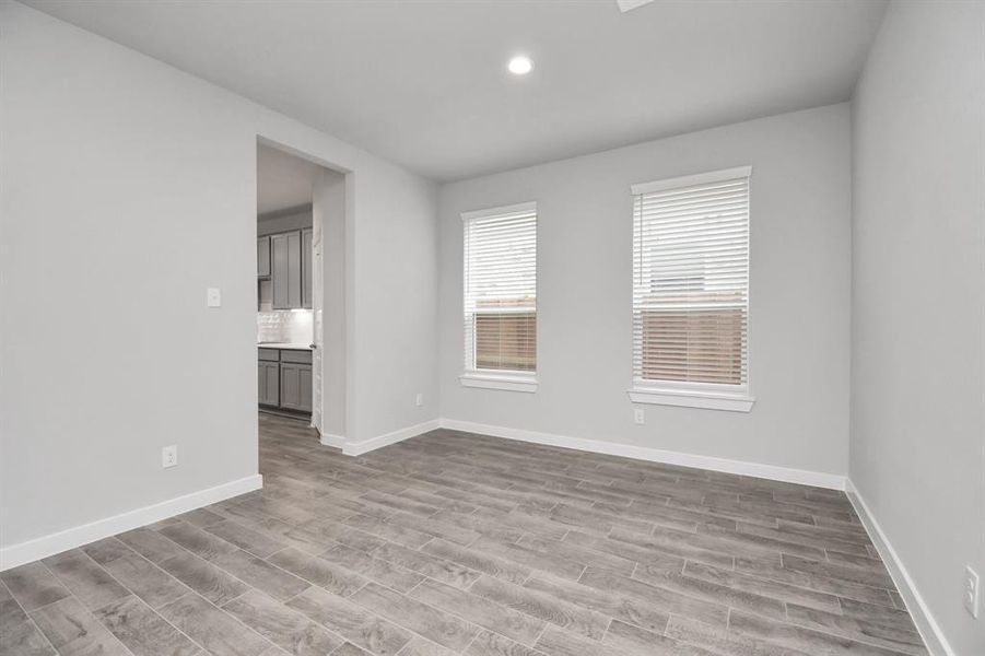 Another view of dining room. Sample photo of completed home with similar floor plan. Actual colors and selections may vary.