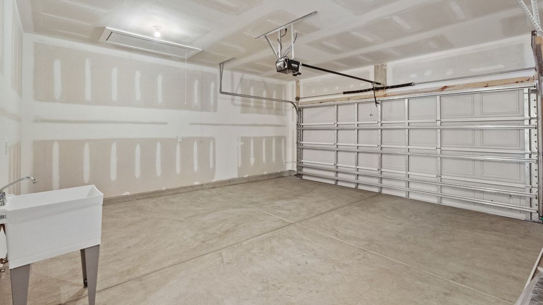 Spacious 2-car garage with extra utility features for convenience.