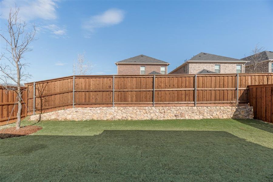 Exterior details and patio area of a home in Spiritas Ranch, Little Elm (Image 3).
