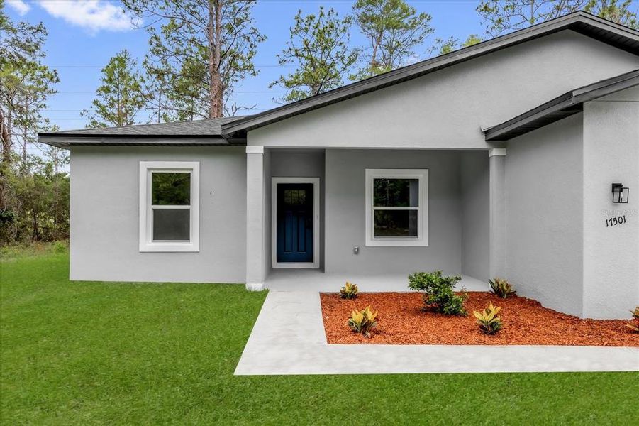 Front exterior of a new home in , Ocala, FL, highlighting curb appeal (Image 9).