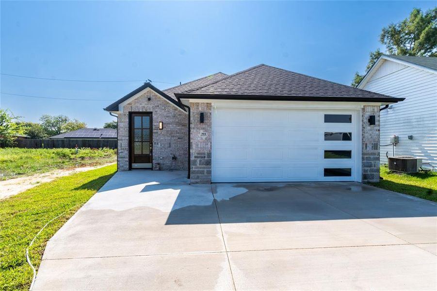 Front exterior of a new home in , Gun Barrel City, TX, highlighting curb appeal (Image 1). Front exterior of a new home in , Gun Barrel City, TX, highlighting curb appeal (Image 1).