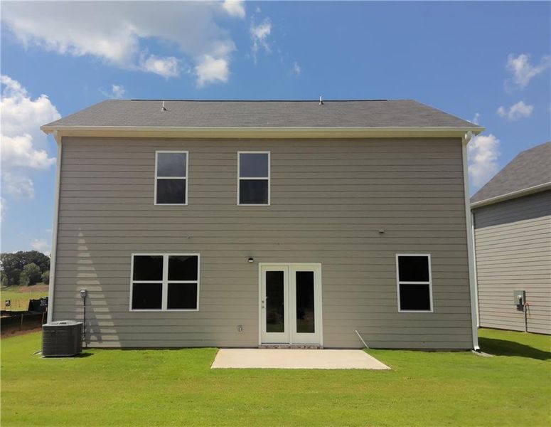 Exterior details and patio area of a home in Teamon Pointe, Griffin (Image 3).