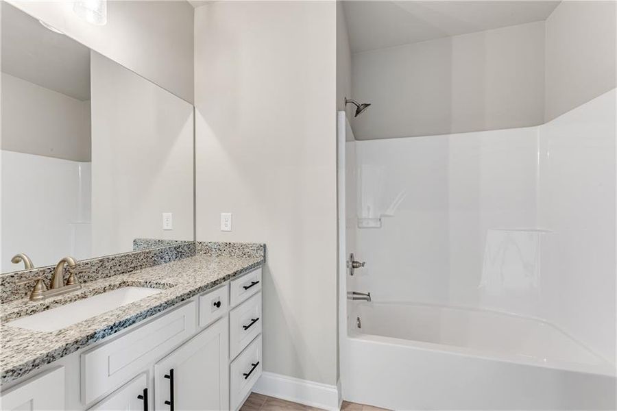 Furnished interior view inside a new home in Hidden Fields, Hoschton (Image 13).