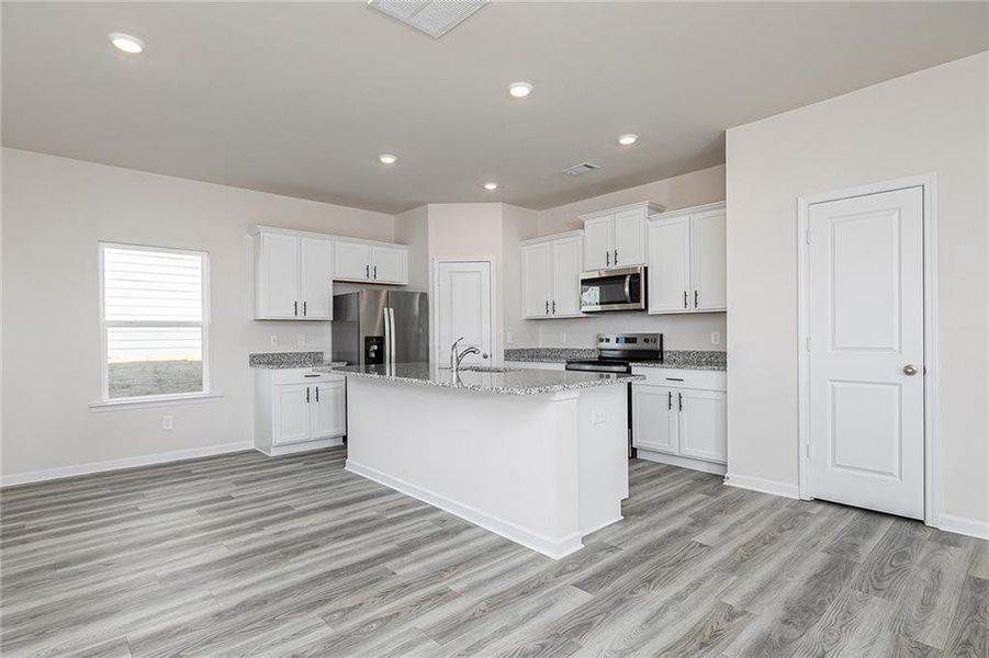 Furnished interior view inside a new home in Conners Landing at Mirror Lake, Villa Rica (Image 4).