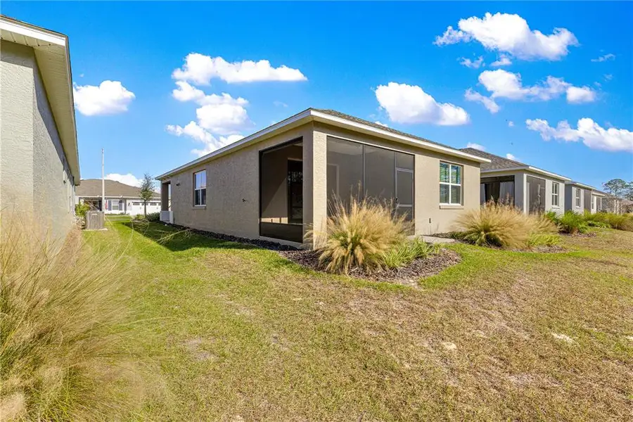 Exterior details and patio area of a home in On Top of the World Communities, Ocala (Image 3).