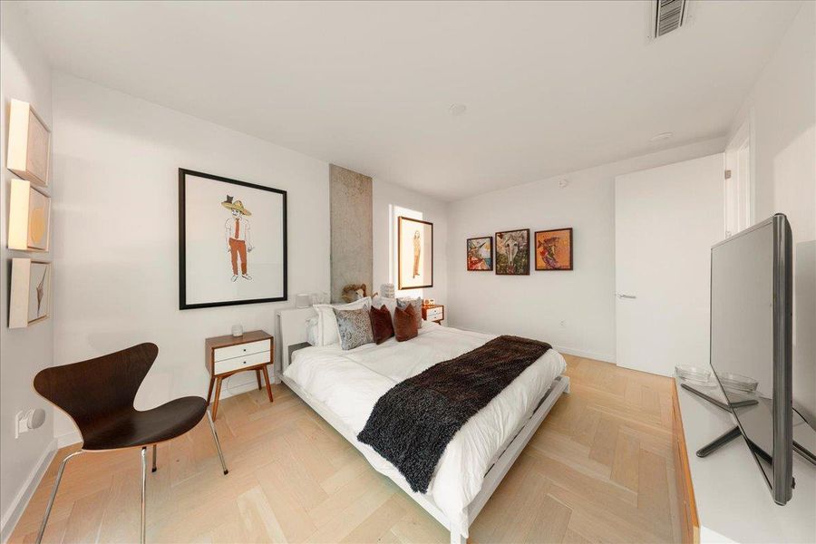 The tranquil space features warm wood accents, soft neutral tones, and thoughtful lighting that complements the natural glow of golden hour, offering the perfect retreat after a busy day.