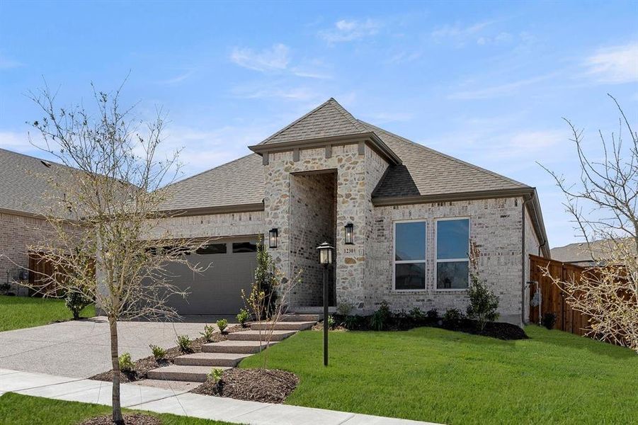 Front exterior of a new home in Inspiration, Lucas, TX, highlighting curb appeal (Image 22). Front exterior of a new home in Inspiration, Lucas, TX, highlighting curb appeal (Image 22).