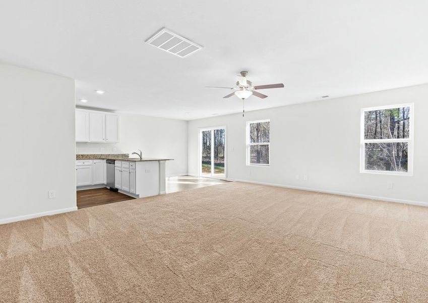 Large living room located off the kitchen and dining area.