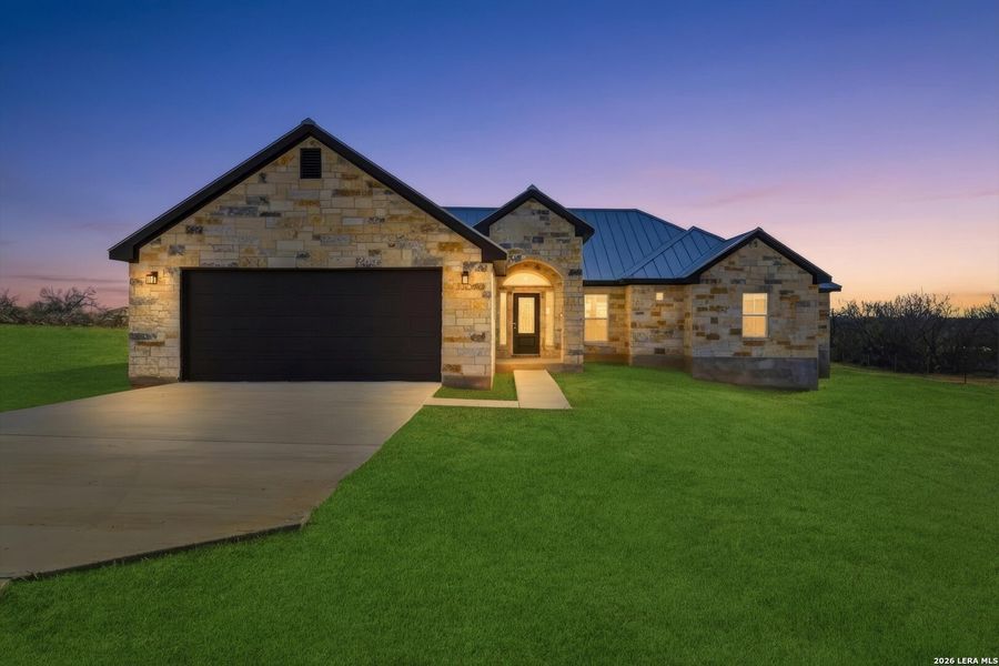 Front exterior of a new home in , St. Hedwig, TX, highlighting curb appeal (Image 28). Front exterior of a new home in , St. Hedwig, TX, highlighting curb appeal (Image 28).
