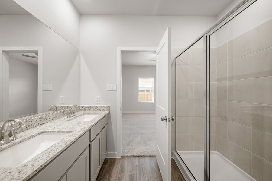 A bathroom with a glass shower.