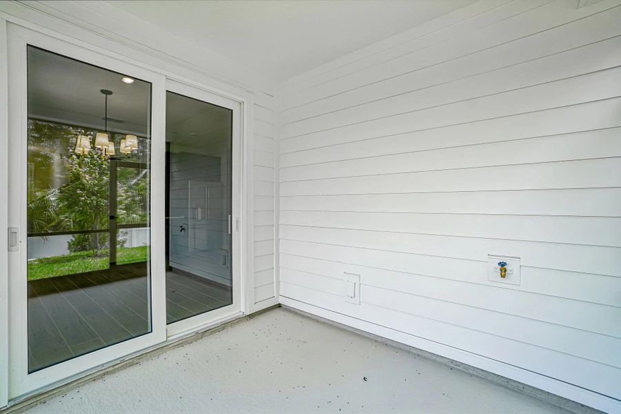 Large sliding glass doors welcome you on to the spacious covered and screened in lanai Large sliding glass doors welcome you on to the spacious covered and screened in lanai
