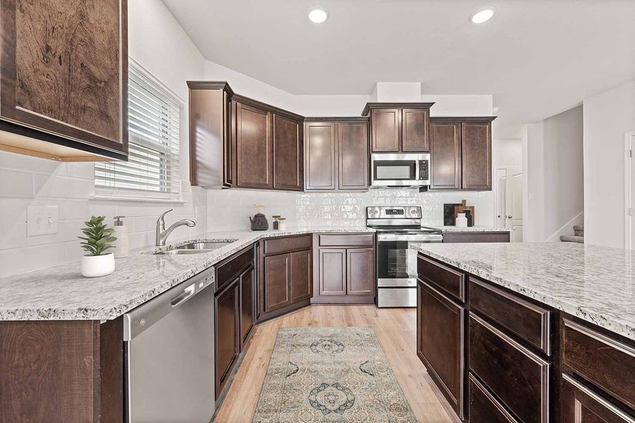 Representative furnished interior of a home built from the Fuller by Omega Builders in Southern Pointe, College Station (Image 5).