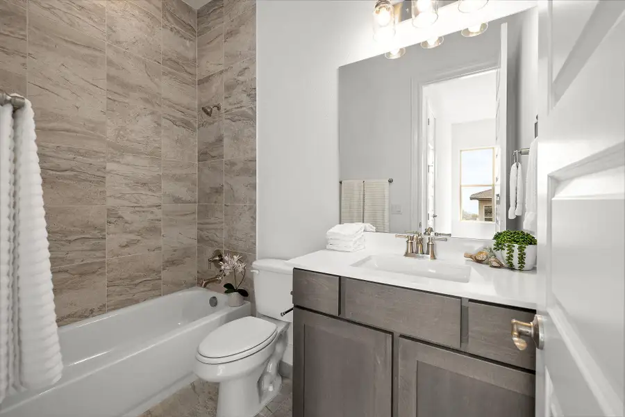 Bathroom featuring vanity and shower / bath combination