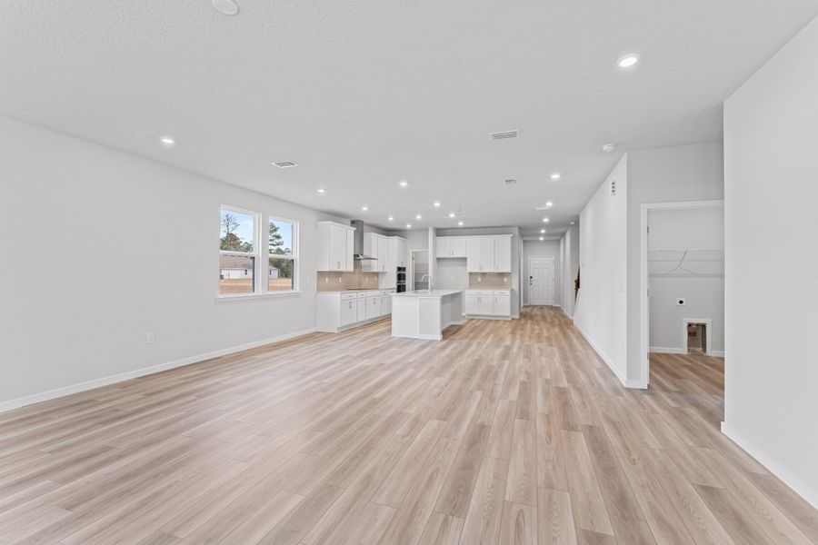 Lot 533 Open Living Area with Kitchen in Back at NorthShore