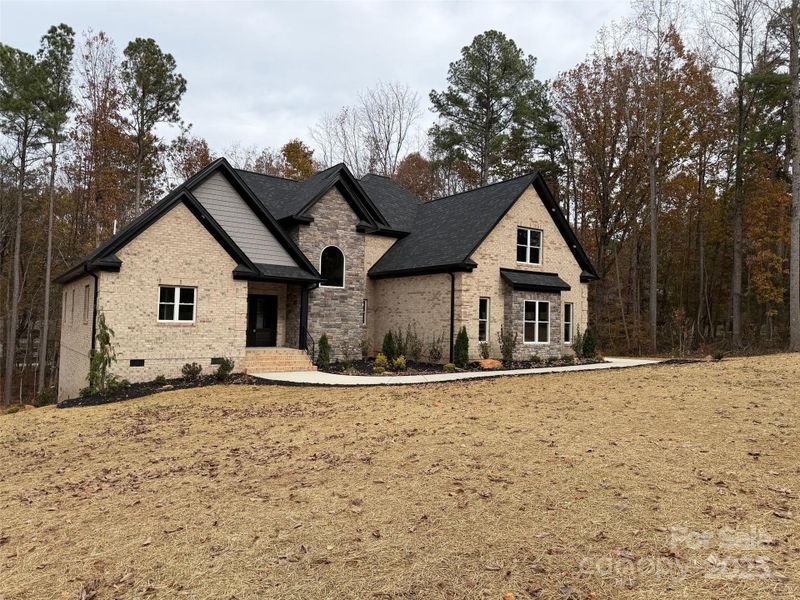Front exterior of a new home in , Lincolnton, NC, highlighting curb appeal (Image 13).