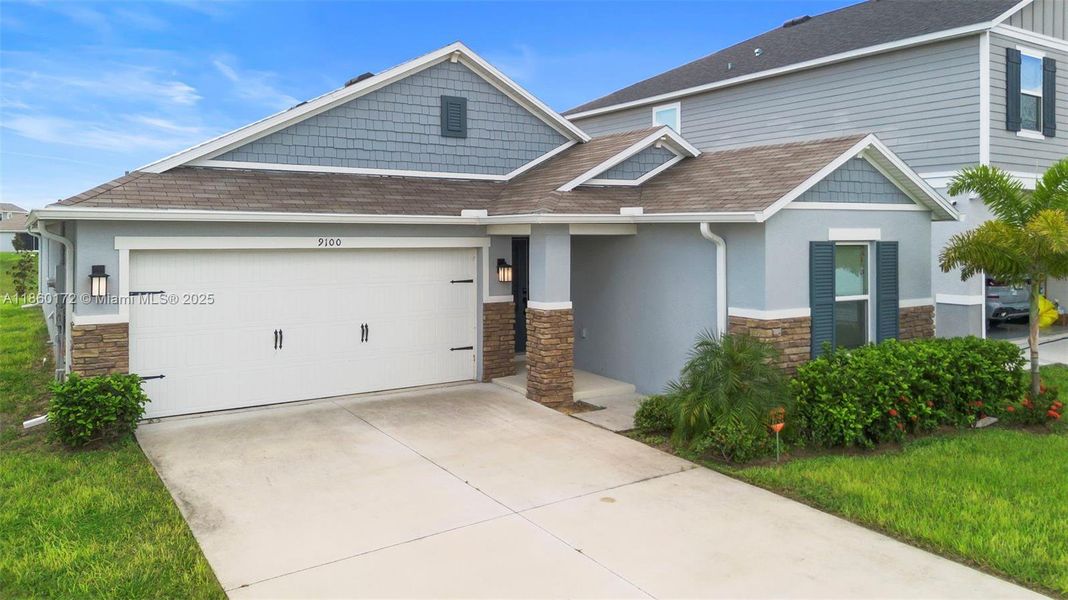 Front exterior of a new home in , Davenport, FL, highlighting curb appeal (Image 1).