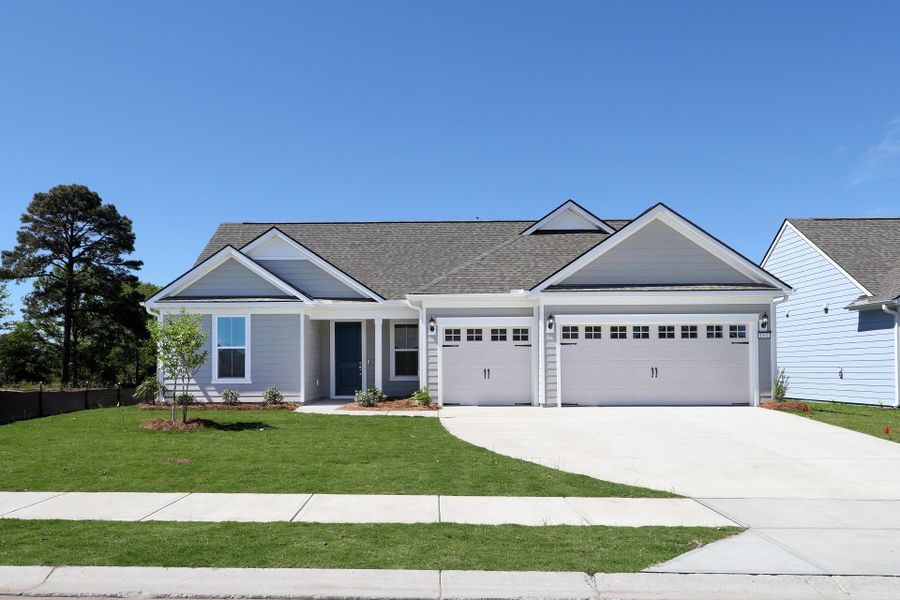Front exterior of a new home in Del Webb North Myrtle Beach, Myrtle Beach, SC, highlighting curb appeal (Image 1). Front exterior of a new home in Del Webb North Myrtle Beach, Myrtle Beach, SC, highlighting curb appeal (Image 1).