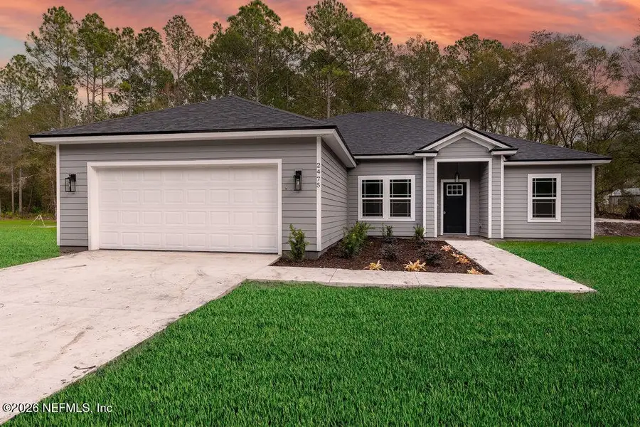 Front exterior of a new home in , Middleburg, FL, highlighting curb appeal (Image 1). Front exterior of a new home in , Middleburg, FL, highlighting curb appeal (Image 1).