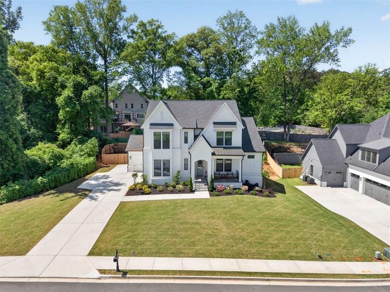 Front exterior of a new home in Town Farms, Peachtree Corners, GA, highlighting curb appeal (Image 28).