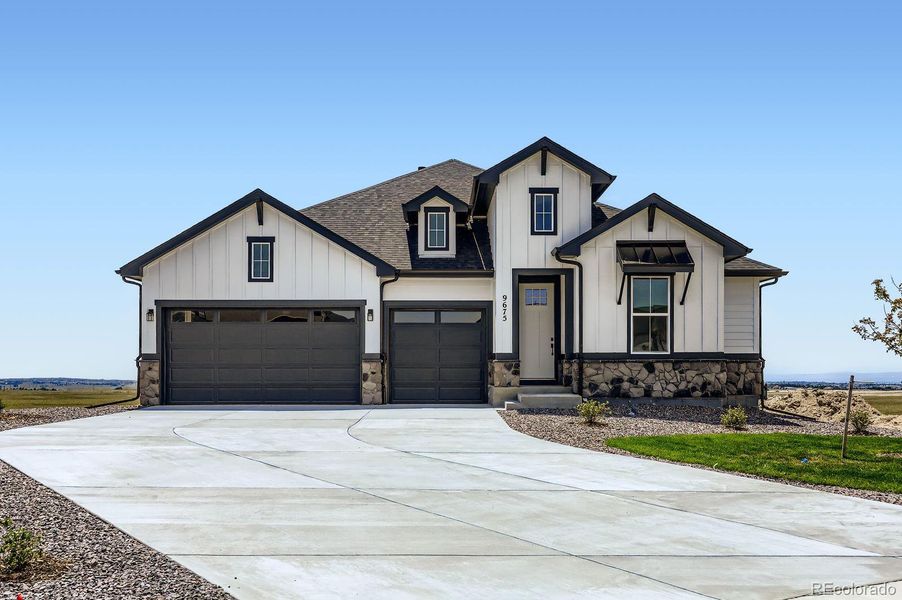 Front exterior of a new home in Timber Ridge, Colorado Springs, CO, highlighting curb appeal (Image 20).