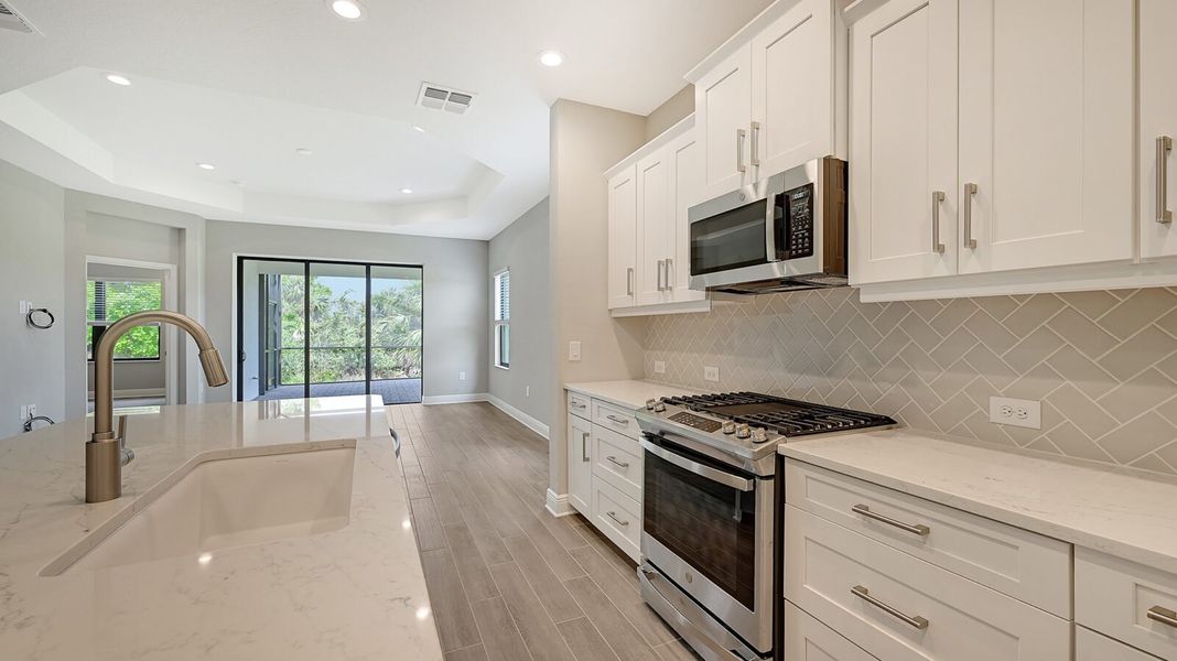 Furnished interior view inside a new home in Boca Royale Golf and Country Club at Wellen Park, Englewood (Image 10).