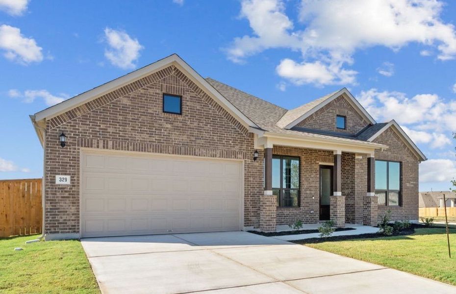 Front exterior of a new home in 6 Creeks, Kyle, TX, highlighting curb appeal (Image 23).