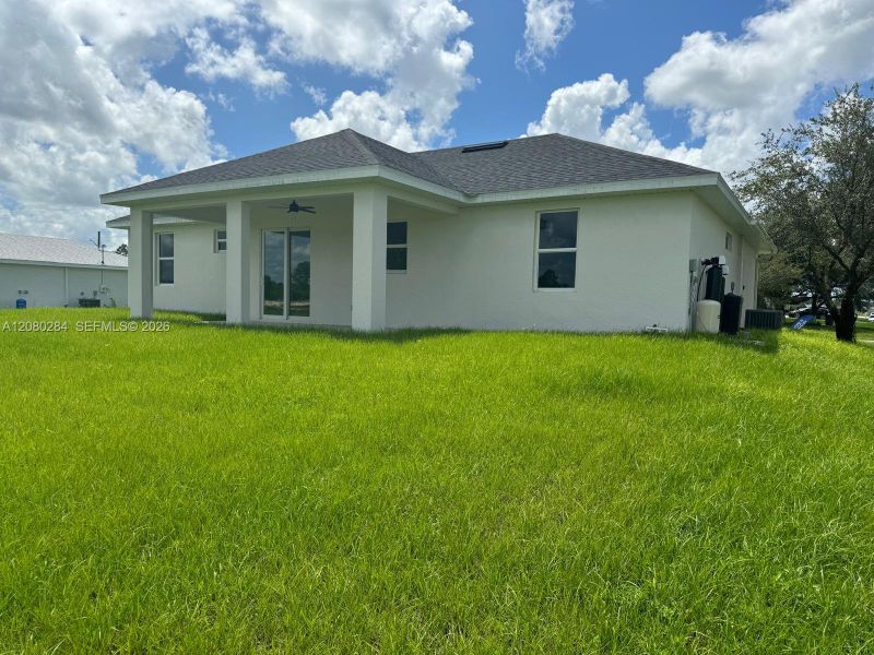 Exterior details and patio area of a home in , Lehigh Acres (Image 4). Exterior details and patio area of a home in , Lehigh Acres (Image 4).