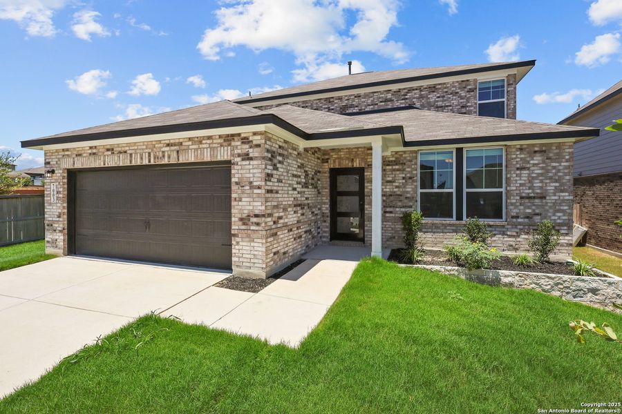 Front exterior of a new home in Comanche Ridge, San Antonio, TX, highlighting curb appeal (Image 43). Front exterior of a new home in Comanche Ridge, San Antonio, TX, highlighting curb appeal (Image 43).