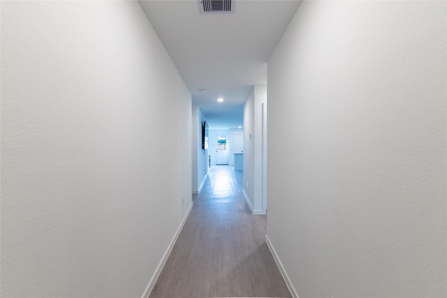The expansive hallway is the perfect spot to display your favorite photos. The expansive hallway is the perfect spot to display your favorite photos.