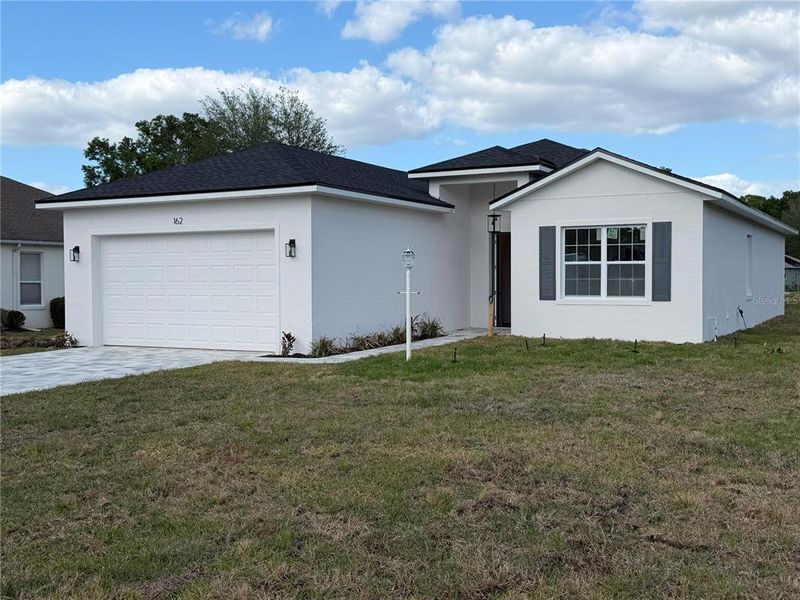 Front exterior of a new home in , Beverly Hills, FL, highlighting curb appeal (Image 1). Front exterior of a new home in , Beverly Hills, FL, highlighting curb appeal (Image 1).