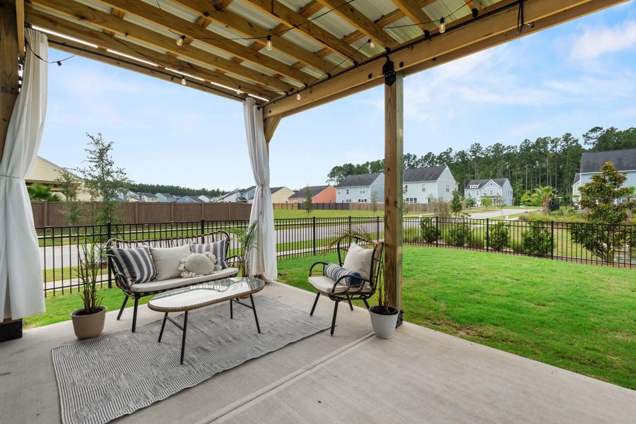 Exterior details and patio area of a home in , Ravenel (Image 29).