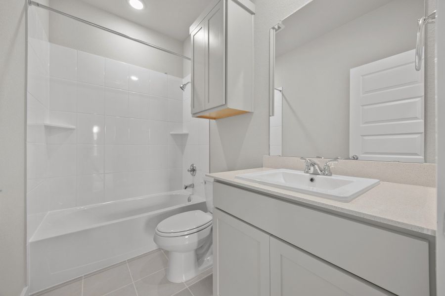 Bathroom in the Brazos home plan by Trophy Signature Homes – REPRESENTATIVE PHOTO