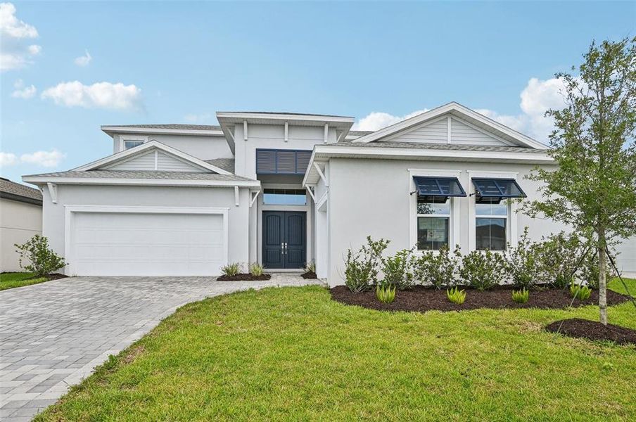 Front exterior of a new home in Biscayne Landing at Seaire, Parrish, FL, highlighting curb appeal (Image 22).